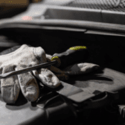 ADL-Auto-Repair-Blog-Image2 mechanic gloves with a flat head screw driver on top - ADL Auto Repair & Driveshafts