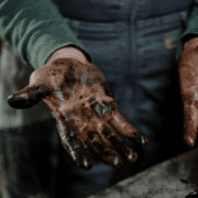 mechanic with dirty hands full of oil and grease - ADL Auto Repair & Driveshafts