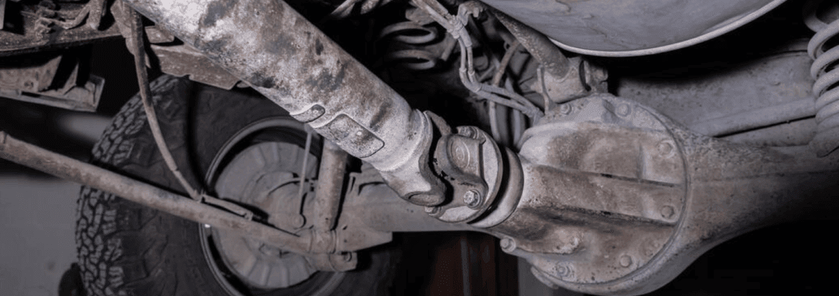 under of a vehicle focusing on the driveshaft - ADL Auto Repair & Driveshafts