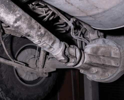 under of a vehicle focusing on the driveshaft - ADL Auto Repair & Driveshafts