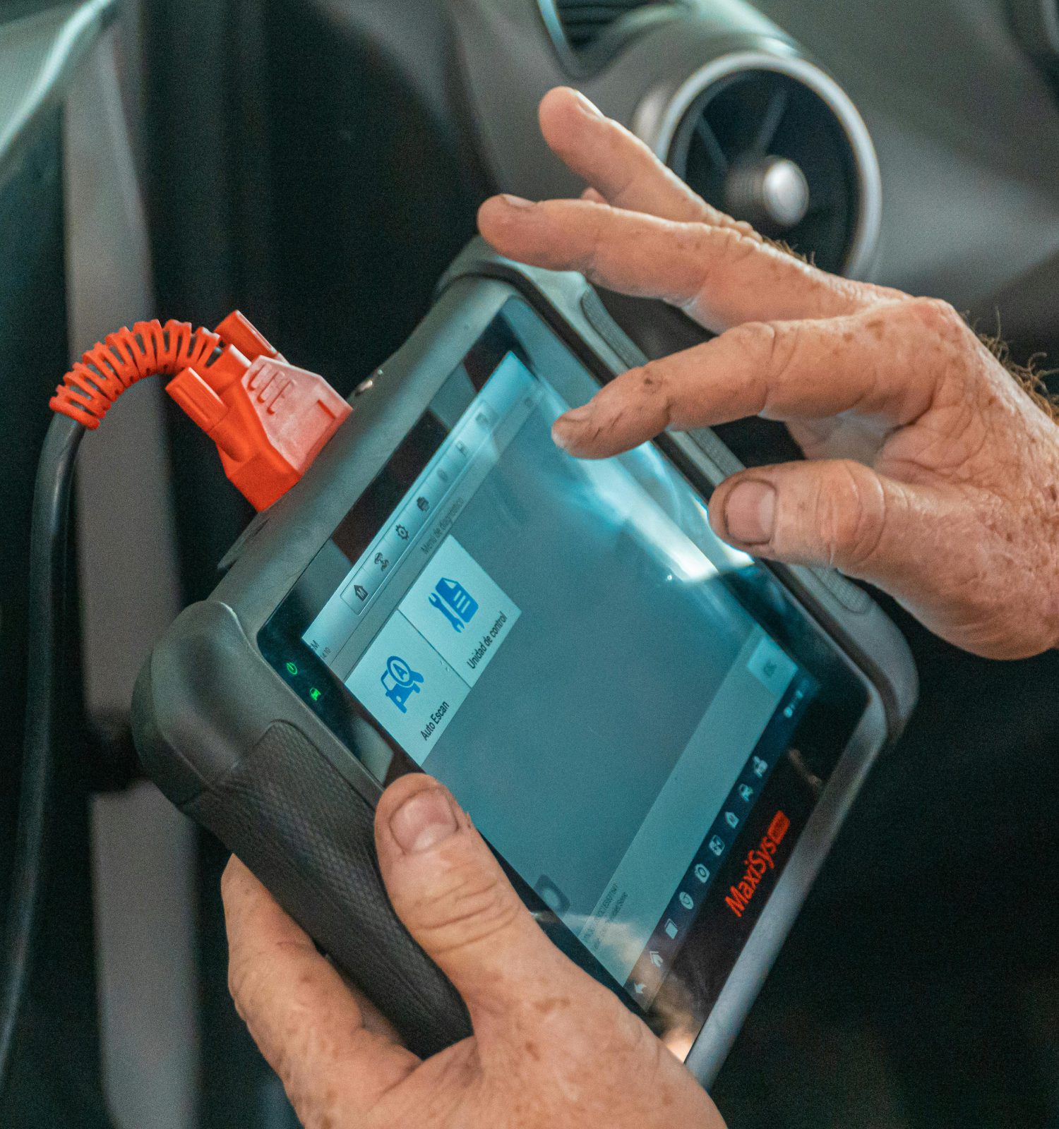 mechanic running a vehicle diagnostics with a tablet - ADL Auto Repair & Driveshafts