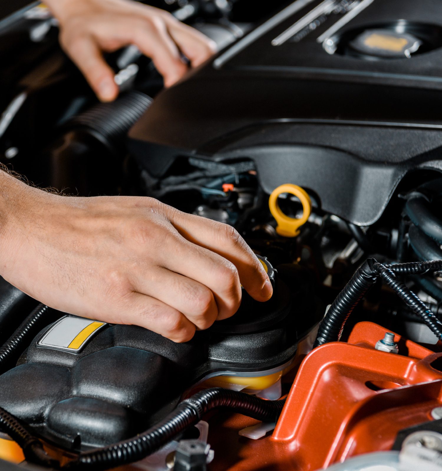 mechanic checking the inside hood of a vehicle - ADL Auto Repair & Driveshafts