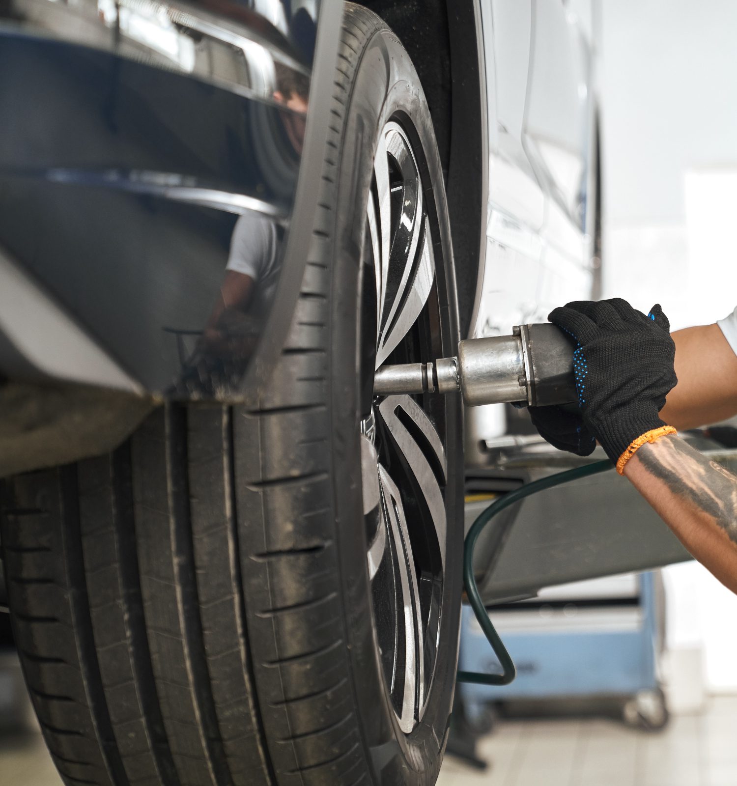 mechanic installing a new tire - ADL Auto Repair & Driveshafts