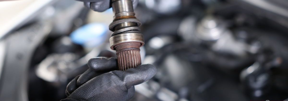 mechanic with a vehicle driveshaft - ADL Auto Repair & Driveshafts Driveshaft Repair in Hugo