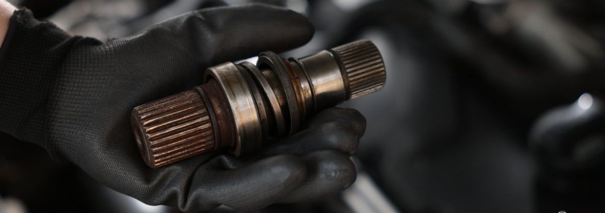 mechanic with a vehicle driveshaft - ADL Auto Repair & Driveshafts driveshaft