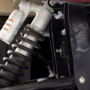 ADLAutoRepairandDriveshafts-suspension-and-alignment-02120261 close up image of a vehicle suspension - ADL Auto Repair & Driveshafts suspension and alignment