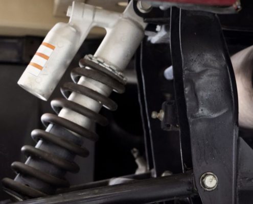 close up image of a vehicle suspension - ADL Auto Repair & Driveshafts suspension and alignment