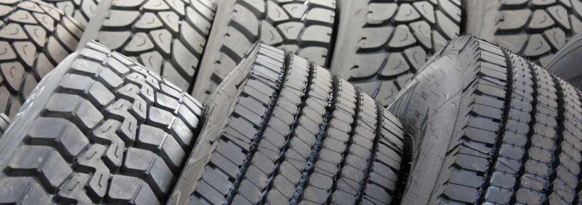 close up of tires stacked beside each other - ADL Auto Repair & Driveshafts vehicle alignment