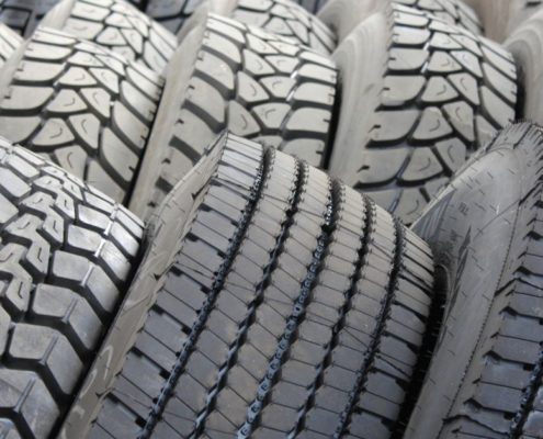 close up of tires stacked beside each other - ADL Auto Repair & Driveshafts vehicle alignment