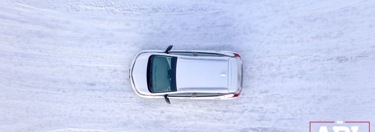 overhead image of a vehicle driving on a snow covered road - ADL Auto Repair & Driveshafts Driveshaft Repair in Hugo