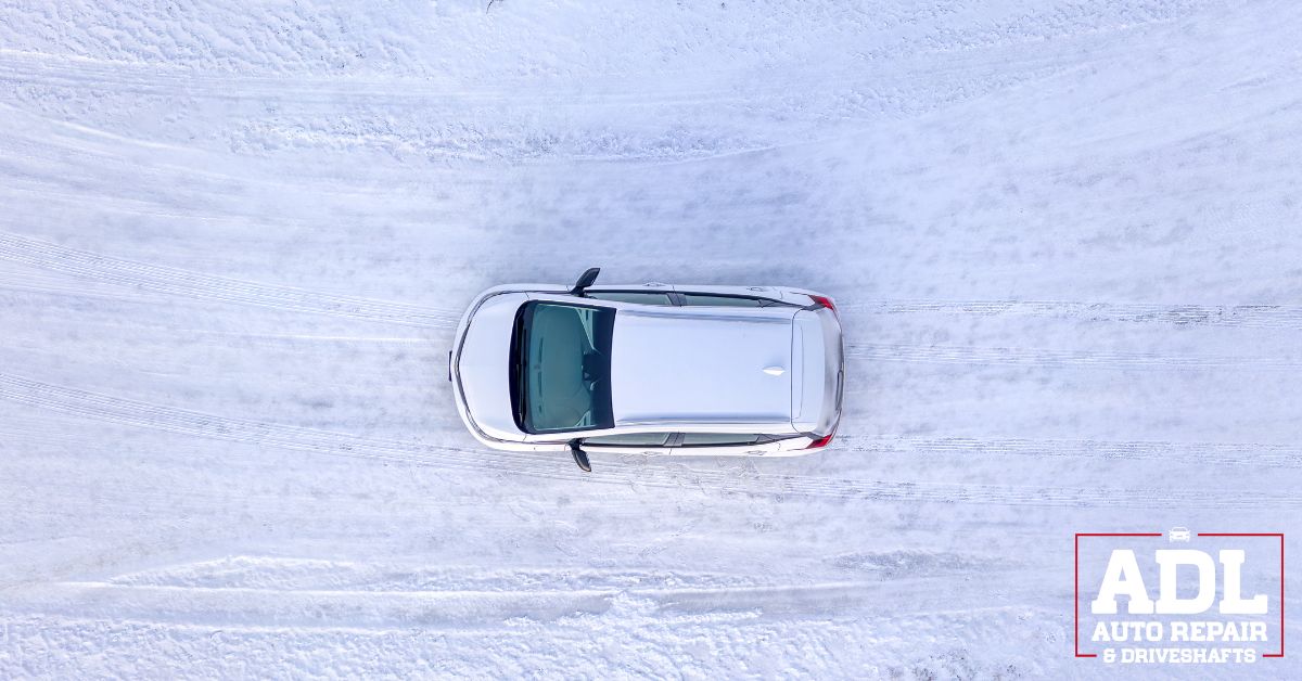 overhead image of a vehicle driving on a snow covered road - ADL Auto Repair & Driveshafts Driveshaft Repair in Hugo