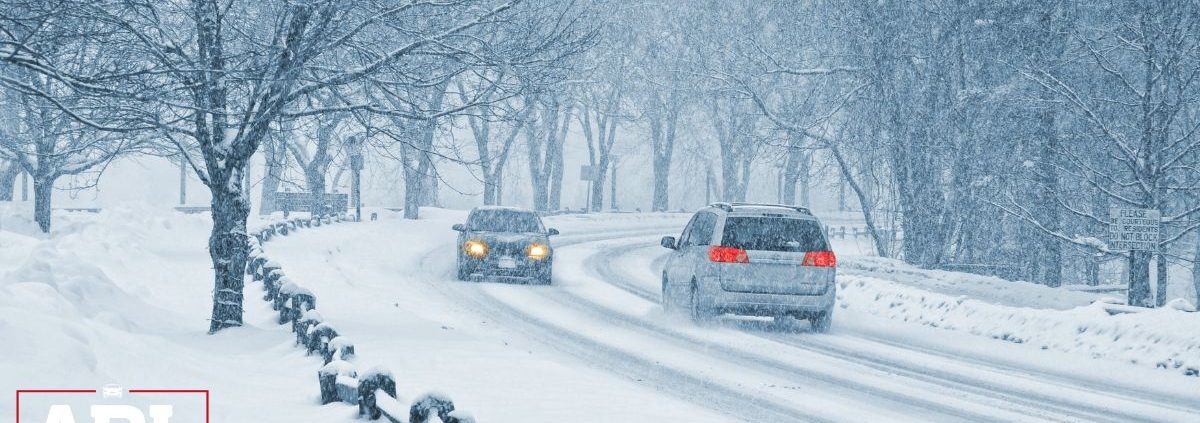 vehicles driving during a snow blizzard ADL Auto Repair & Driveshafts 4WD System Maintenance