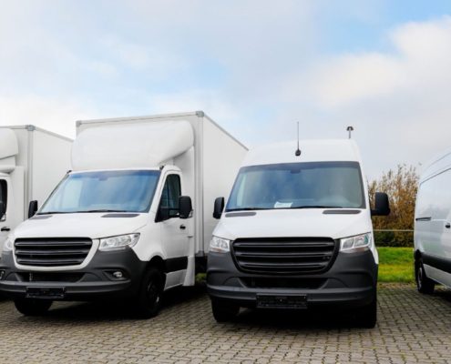 line up of commercial fleet vehicles/trucks - ADL Auto Repair Driveshafts small business fleet maintenance