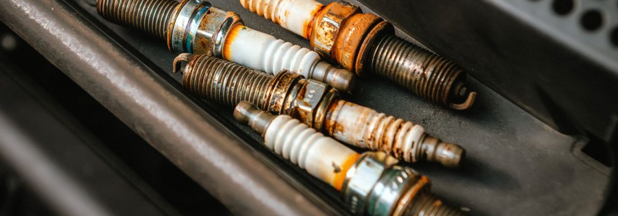 worn out spark plugs from a vehicle - ADL Auto Repair and Driveshafts Auto Tune-Up Repair