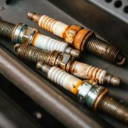 worn out spark plugs from a vehicle - ADL Auto Repair and Driveshafts Auto Tune-Up Repair