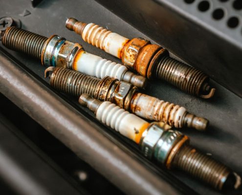 worn out spark plugs from a vehicle - ADL Auto Repair and Driveshafts Auto Tune-Up Repair