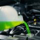 mechanic adding bright green coolant fluid to a vehicle - ADL Auto Repair & Driveshafts